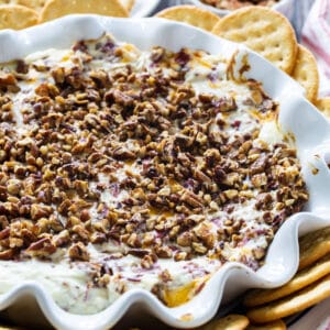 Hot Pecan Beef Dip surrounded by crackers.