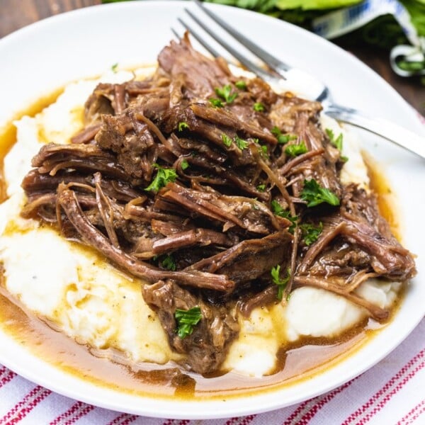 Instant Pot Pot Roast served ver mashed potatoes.