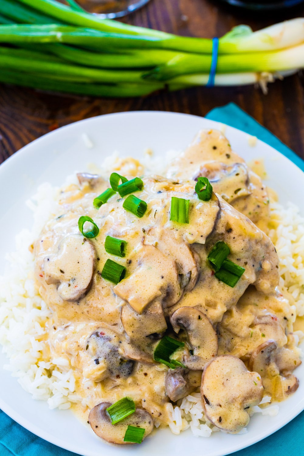 Instant Pot Champagne Chicken over rice on a plate.