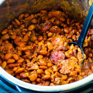Instant Pot Cowboy Beans in Instant Pot with spoon.