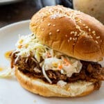 Instant Pot Pulled Pork on a bun with coleslaw.