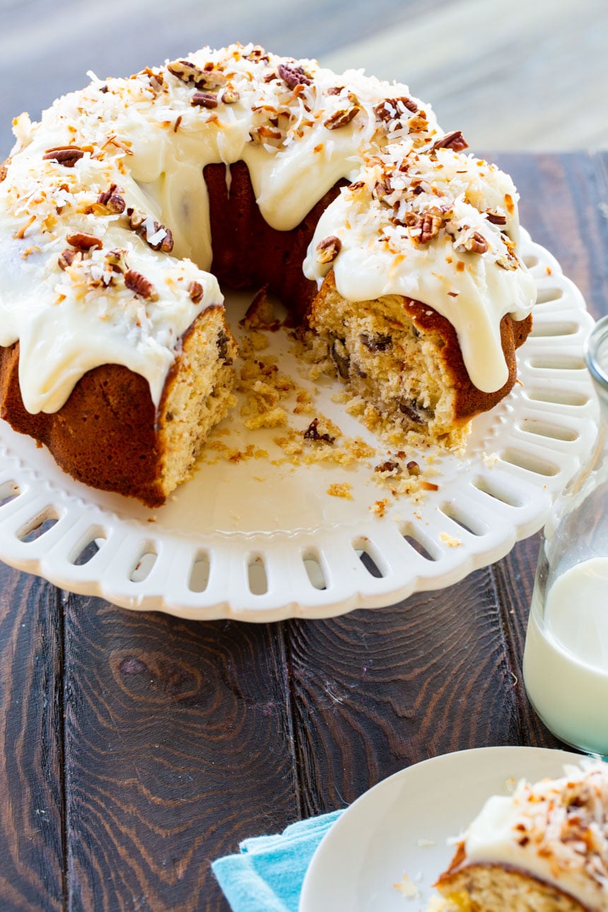 Italian Cream Bundt Cake with several slices cut out.