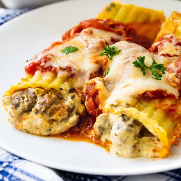 Two Italian Sausage Manicotti on a plate.