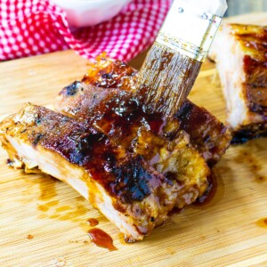 Brushing sauce on Jack Daniels Ribs