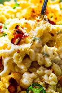 Serving spoon scooping Jalapeno Popper Mac and Cheese
