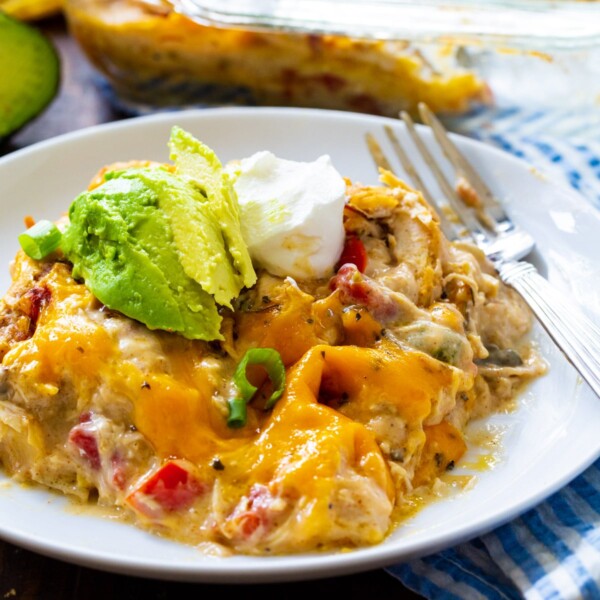 King Ranch Chicken Casserole topped with avocado on a plate.