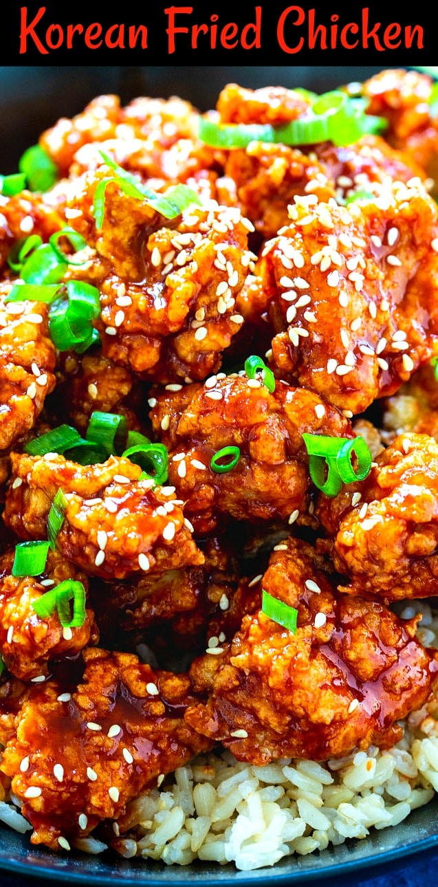 Close-up of Korean Fried Chicken sprinkled with sliced green onions.