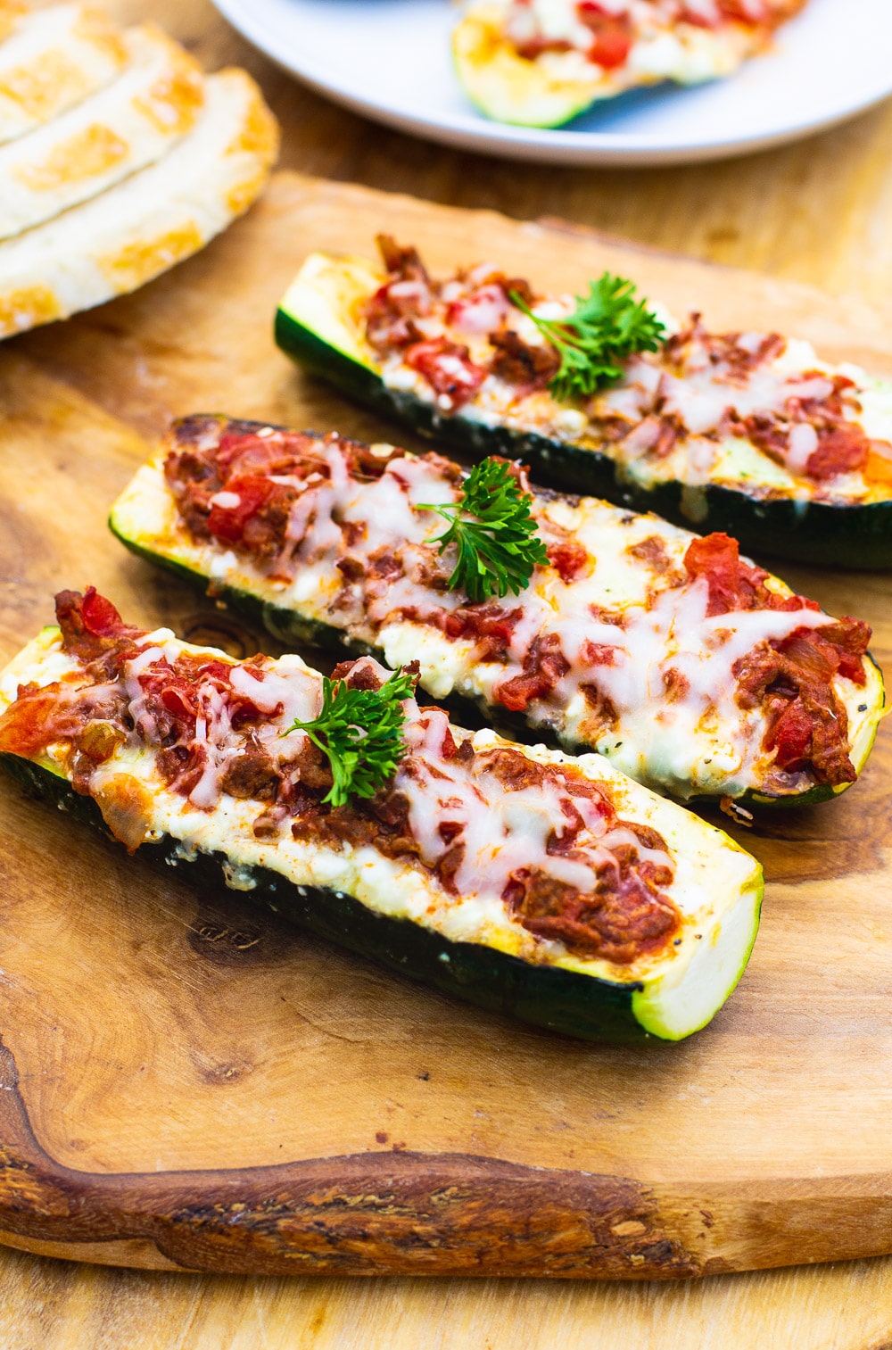 Lasagna Zucchini Boats on a cutting board.