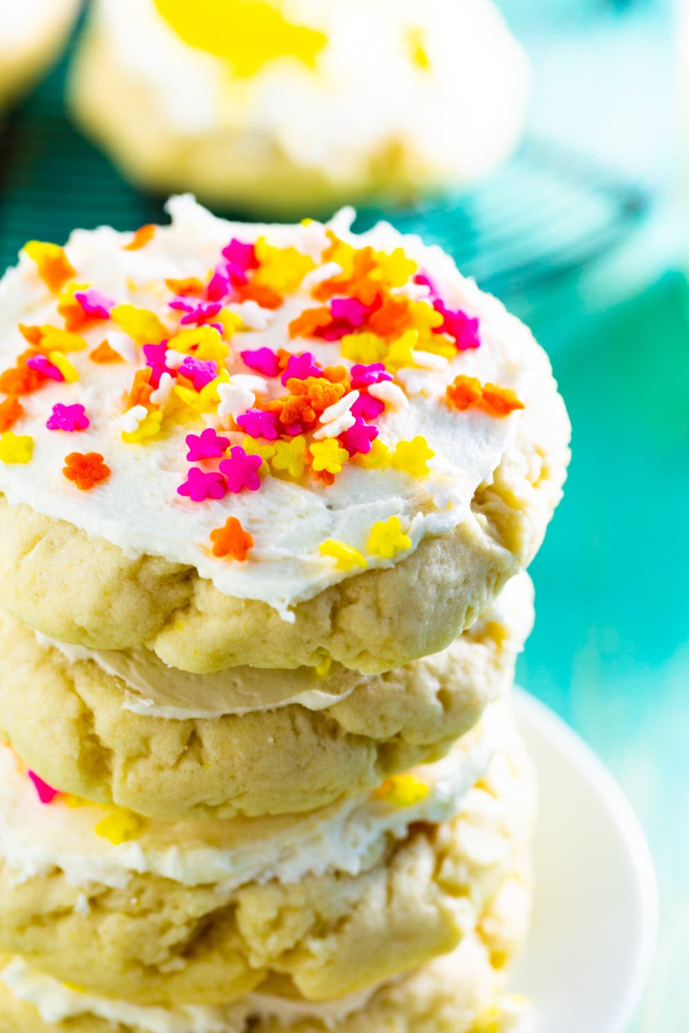 Lofthouse Sugar Cookies stacked up on a plate.