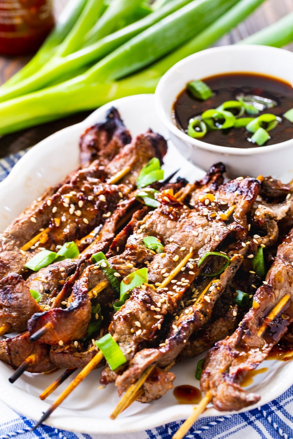 Steak Skewers with bowl of dipping sauce.