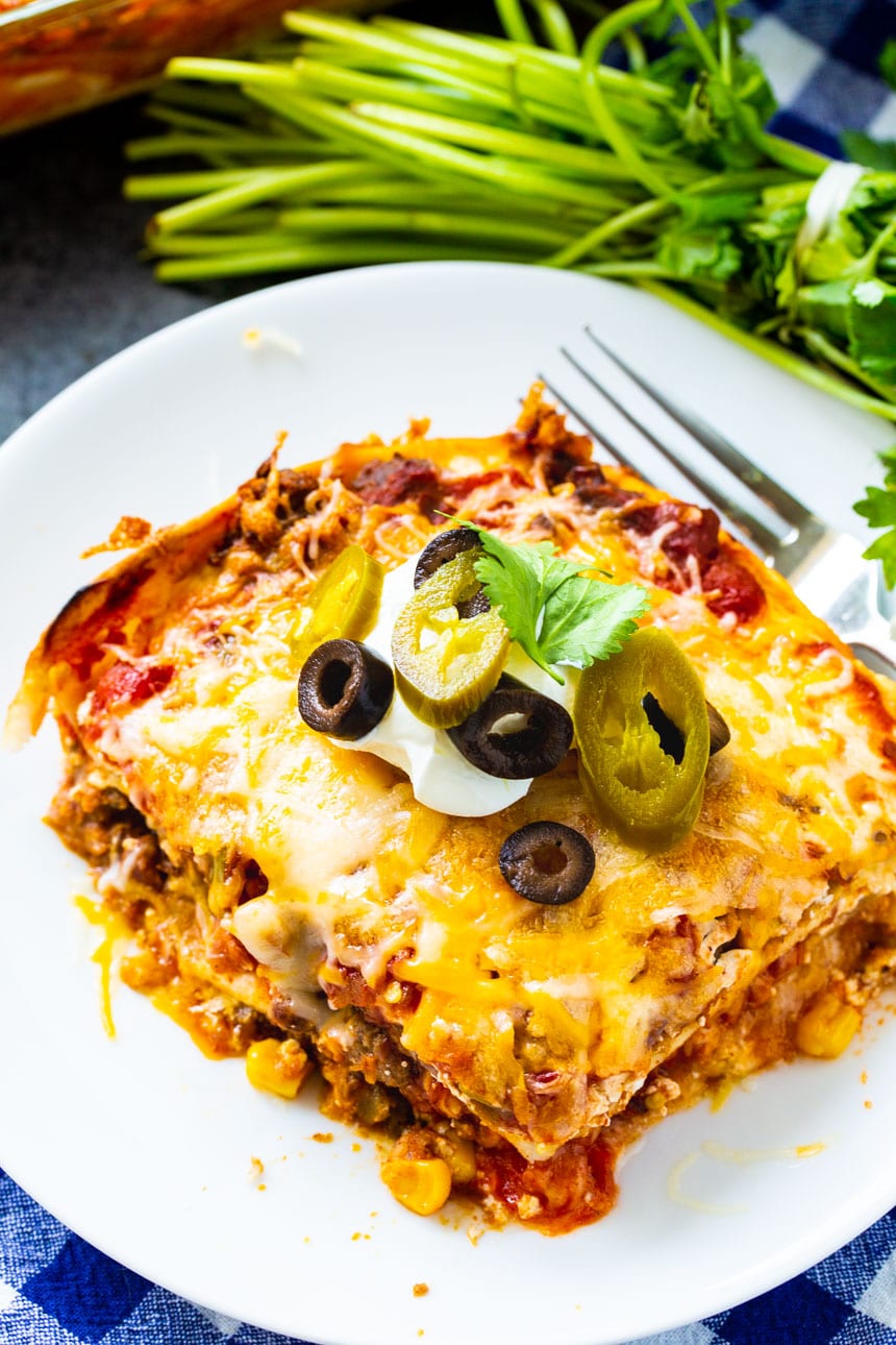 Slice of Mexican Lasagna on a white plate.