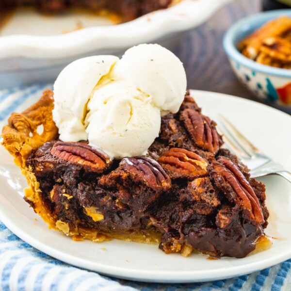 Slice of Mocha Pecan Pie on a plate.