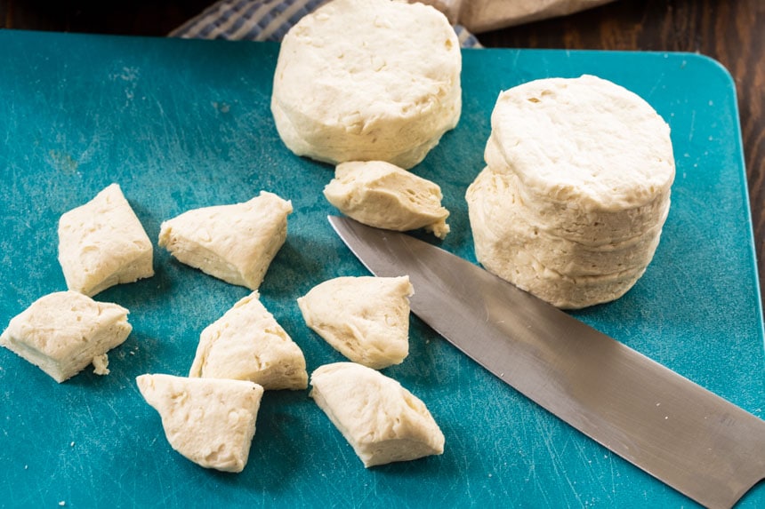 Cutting biscuits into pieces.