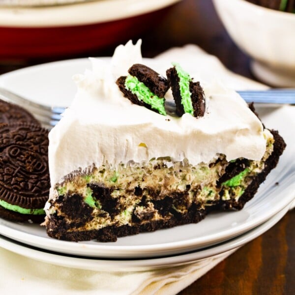 Slice of No-Bake Mint Oreo Pie on a plate.