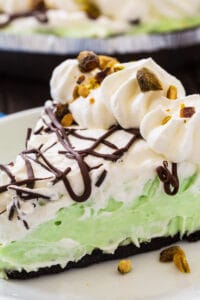 Slice of No-Bake Pistachio Pudding Pie on a plate.