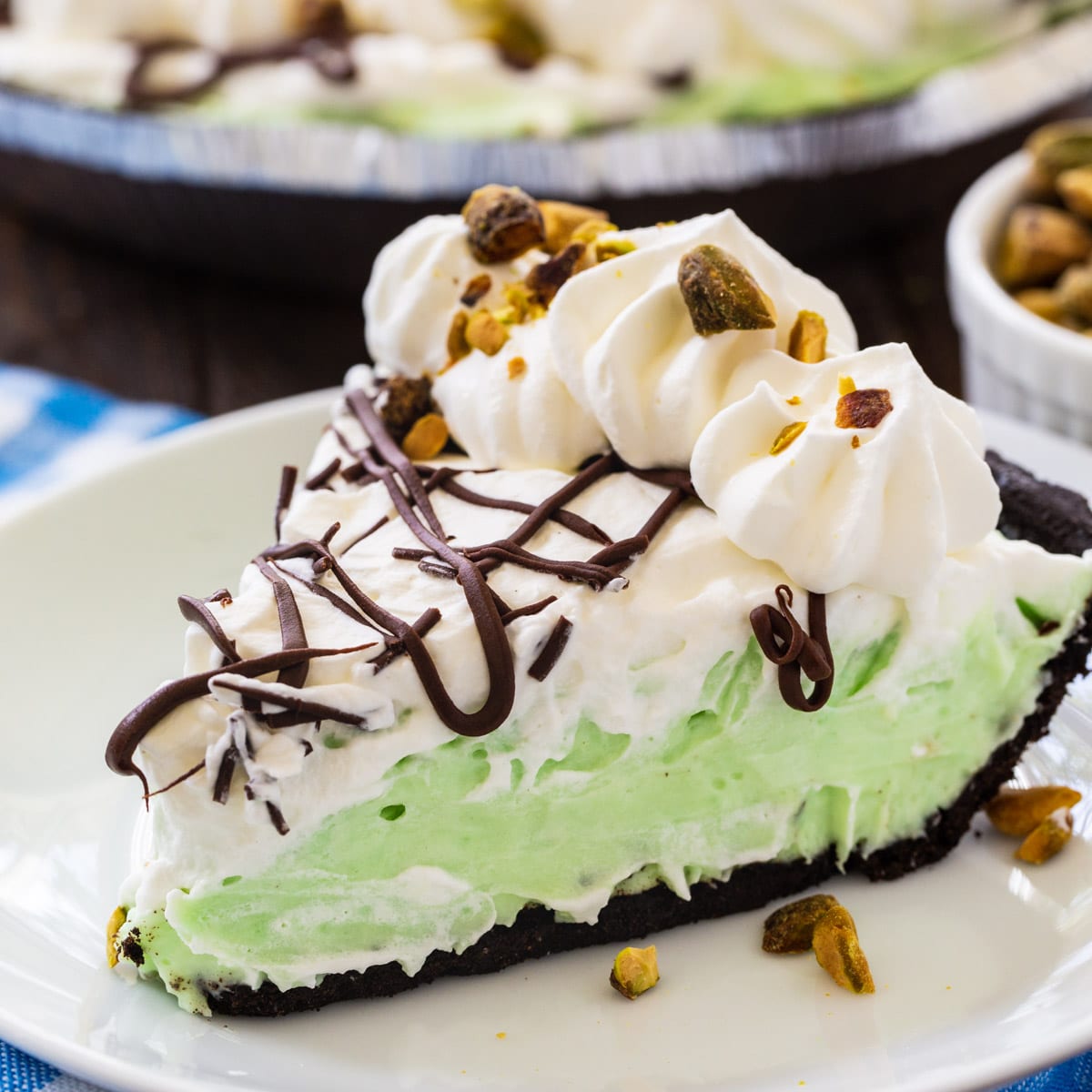 Slice of No-Bake Pistachio Pudding Pie on a plate.
