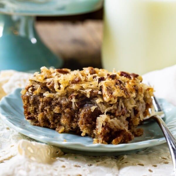 Old-Fashioned Oatmeal Cake on a plate and a jug of milk.