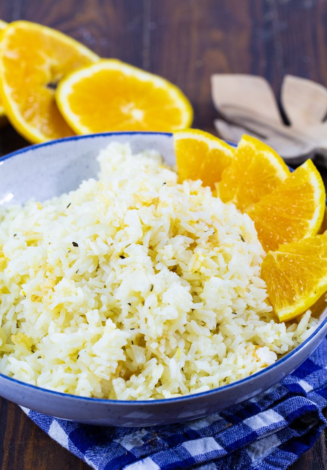 Orange Rice in blue bowl with orange segments.