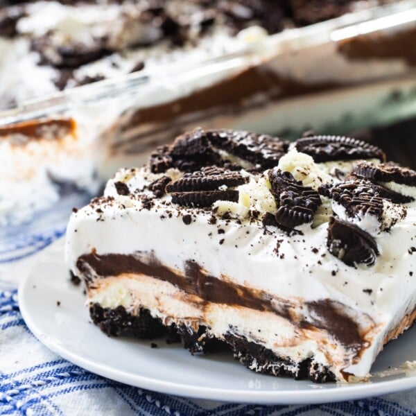 Piece of Oreo Delight on a small white plate.