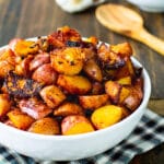 Bowl full of potatoes cooked with paprika.