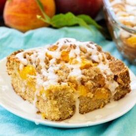 Slice of Peach Crisp Coffee Cake on a white plate