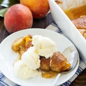 Peach Dumpling on a plate with vanilla ice cream