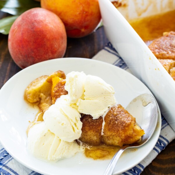 Peach Crescent Dumpling od a plate with ice cream.