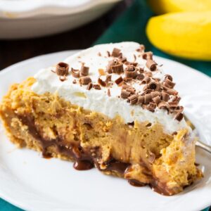 Slice of Peanut Butter Banana Pie on a white plate.