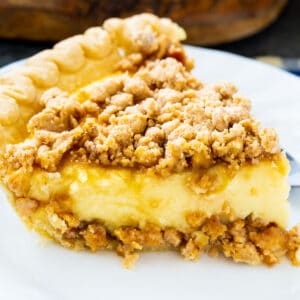 Slice of Peanut Butter Crunch Pie on a plate.
