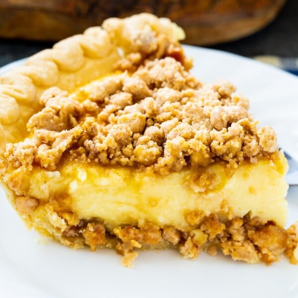 Slice of Peanut Butter Crunch Pie on a plate.