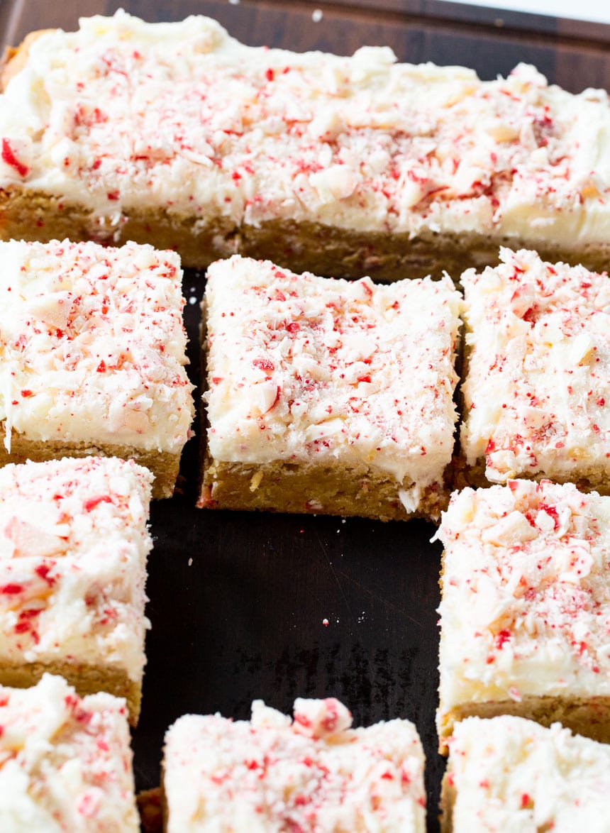 Peppermint Blondies cut into squares on a cutting board.