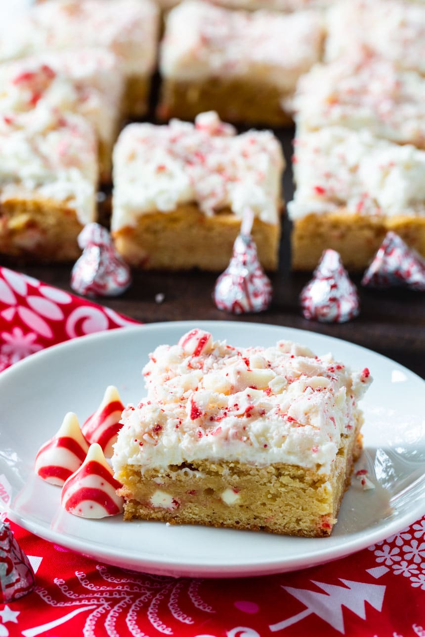 Peppermint Blondie on a plate with more blondies in background.