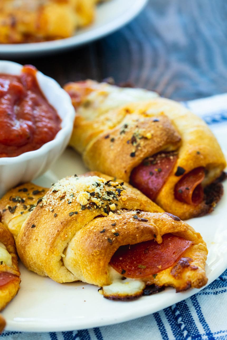 Close-up of Pepperoni Crescent Rolls on a white plate.