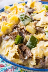 Philly Cheesesteak Mac and Cheese in blue and white bowl.