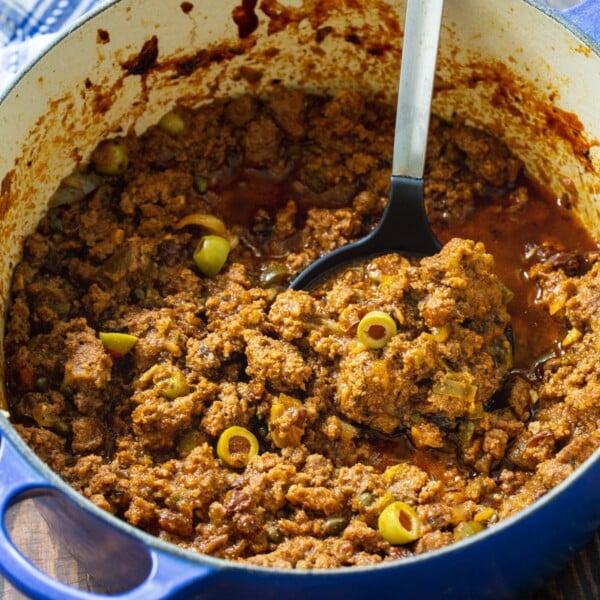 Picadillo in a blue Dutch oven.