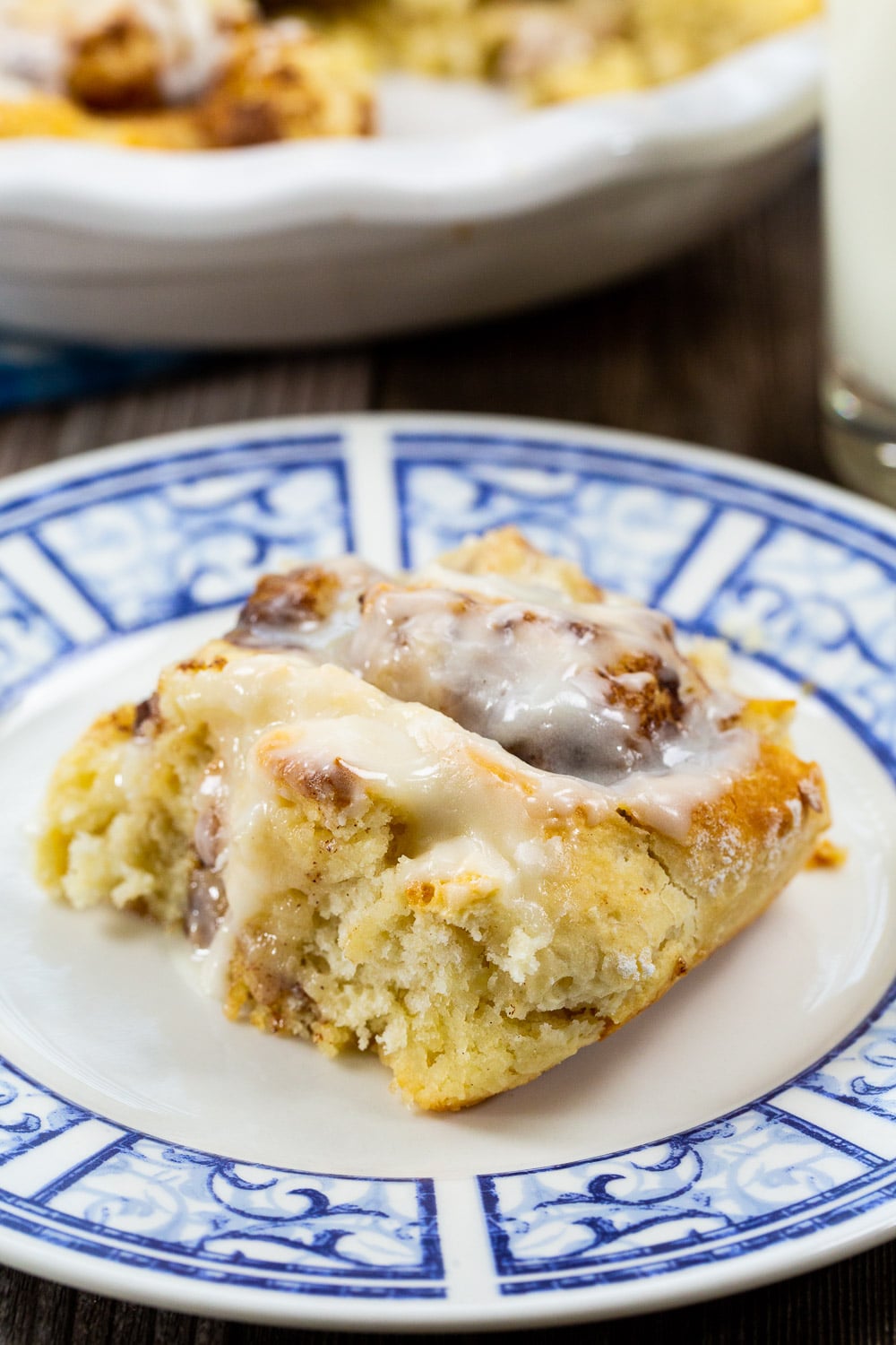 Cinnamon Roll with glaze on a plate.