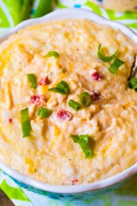 Pimento Cheese Grits in a bowl with a spoon.