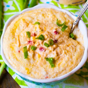 Pimento Cheese Grits in a bowl with a spoon.