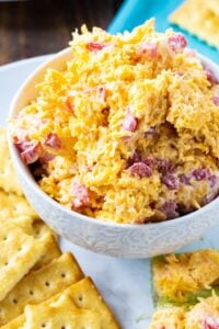 Pimento Cheese in a bowl surrounded by club crackers.