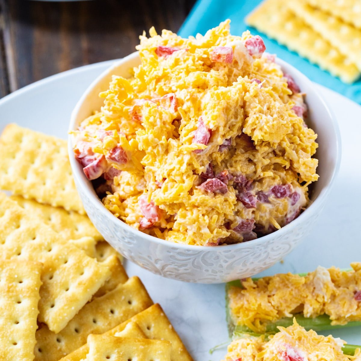Pimento Cheese in a bowl surrounded by club crackers.
