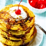 Stack of Pineapple Upside Down Pancakes on a plate.