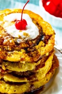 Stack of Pineapple Upside Down Pancakes on a plate.