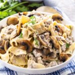 Ground Beef Stroganoff with egg noodles in a white bowl