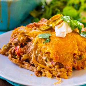 Slice of Pulled Pork King Ranch Casserole on a plate.