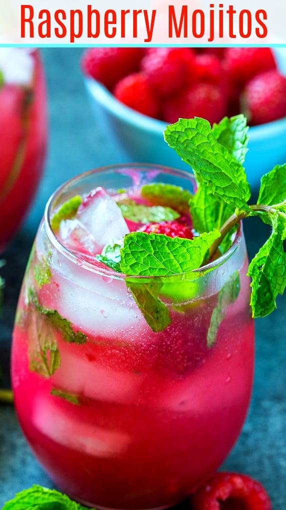 Mojito with raspberries in a glass with fresh mint.