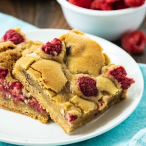 Two Raspberry Bars om a white plate.
