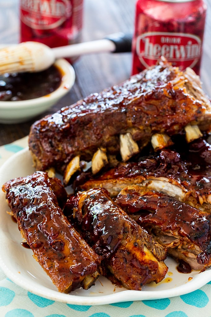 Baby Back Ribs with Spicy Cheerwine Glaze stacked up on a plate.