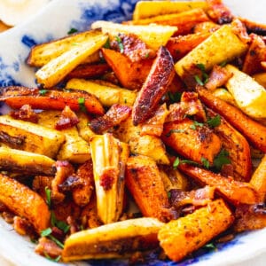 Roasted Carrots and Parsnips on a blue and white serving platter.