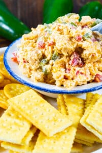 Roasted Jalapeno Pimento Cheese in a bowl surrounded by crackers.