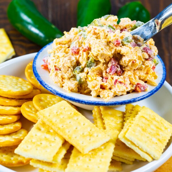 Roasted Jalapeno Pimento Cheese in a bowl surrounded by crackers.